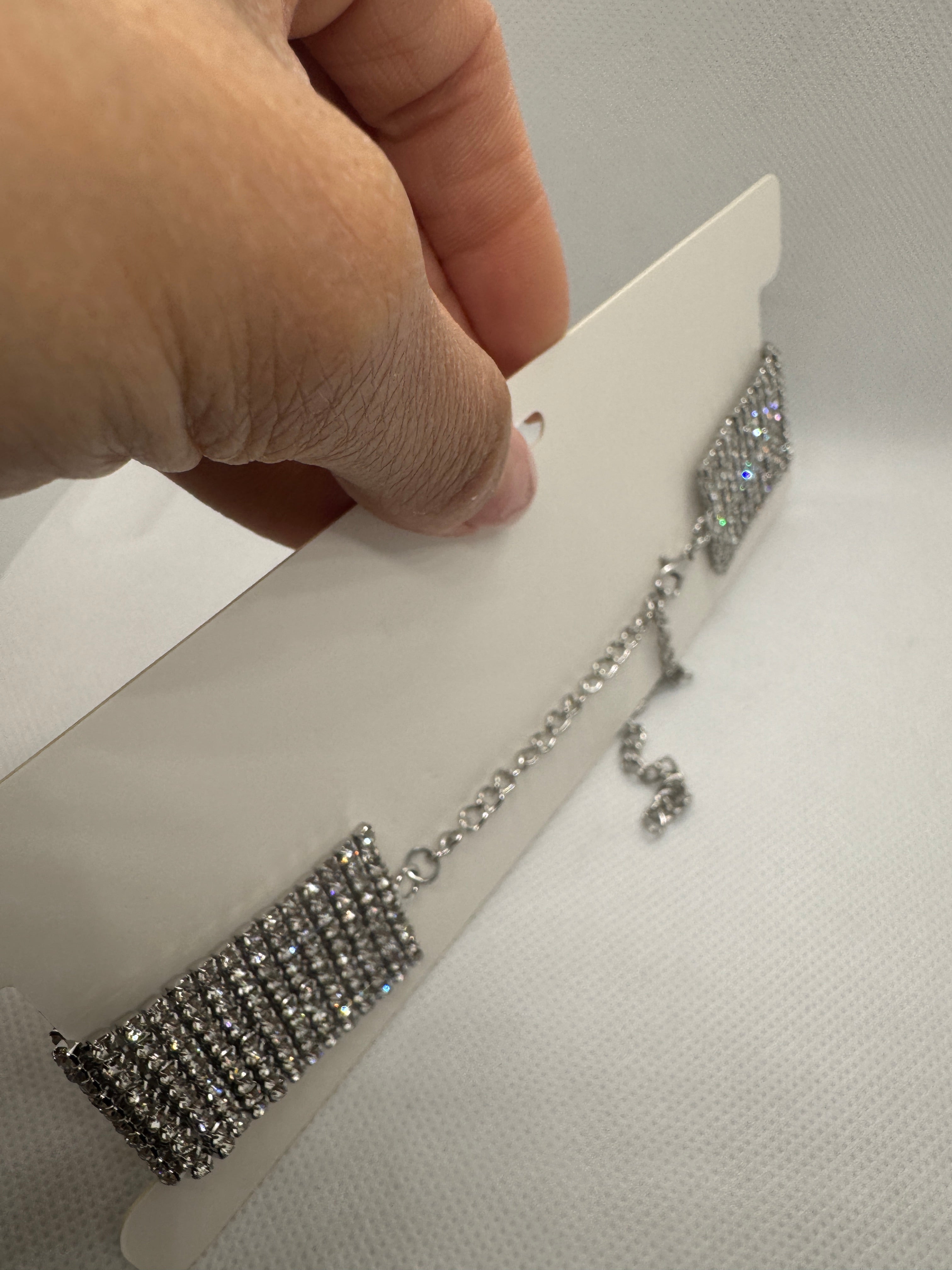 Girocollo fascia larga con micro brillantini argento